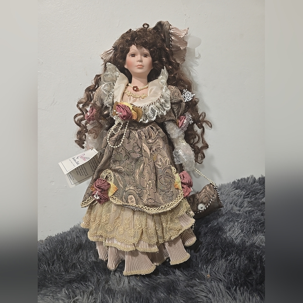 Elegant Victorian Porcelain Doll with Brown Curls